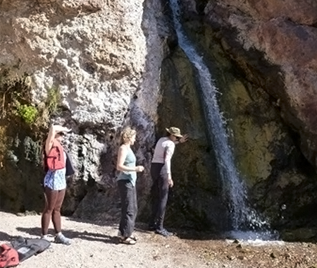 Group Near a Waterfall 
